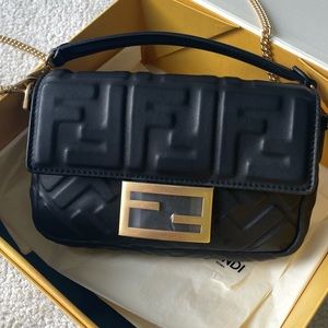 NOW ON THEREALREAL FENDI mini baguette black calfskin zucca with crossbody chain